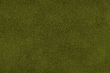 Dark green suede fabric background with matte nap velvet texture. Olive tones and soft felt textile surface in macro © nikol85