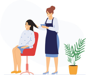 Obraz premium Hairdresser applying treatment to client's hair in salon