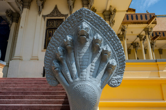 Seven-headed naga statue at temple entrance in Phnom Penh