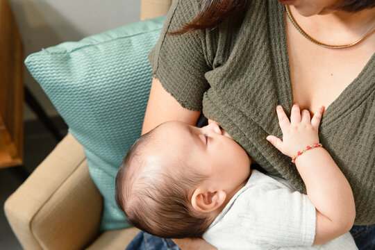 Parent nurturing newborn, providing essential maternal care