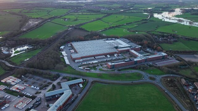 Aerial view of the busy logistics sector in Atherton showing a giant distribution hub with active HGV traffic and export operations