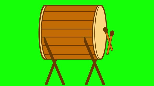 A traditional wooden beduk drum is being struck with mallets, producing rhythmic sounds often heard during Ramadan to signal prayer time and bring the community together in celebration.