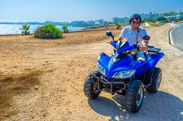 Obraz premium The tourist on the quad on Cape Grecco in Ayia Napa, Cyprus