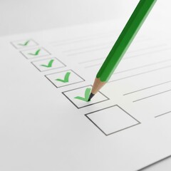 Checklist marked with green pencil on white sheet