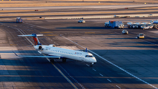 Delta Connection Regional Jet Taxiing at JFK Airport During Golden Hour &ndash; New York, USA