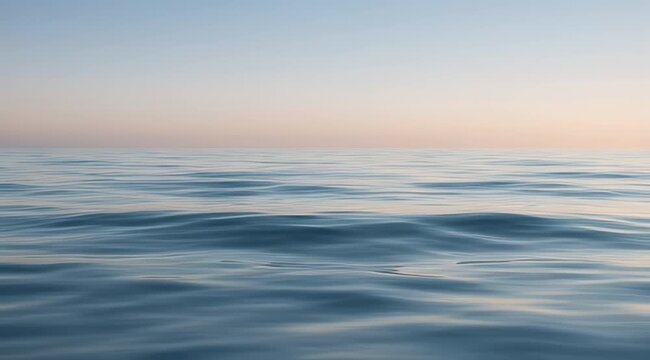 Softly rippling ocean surface under a gradient sky