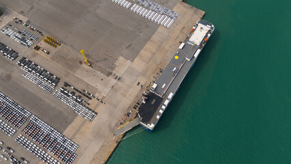 aerial view of new cars parked at the parking area of automobile factory, waiting for RORO transport of international	