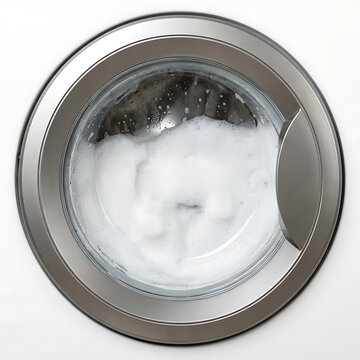 Washing machine view with soap bubbles inside from above  