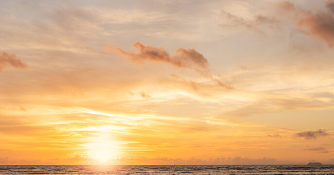 Sunset Sky clouds beautiful Sea in the evening summer season Background, Yellow warm sun dawn,Orange sunrise golden hour, Landscape horizon Colorful nature sun light sea sky cloud,Dusk Sky background