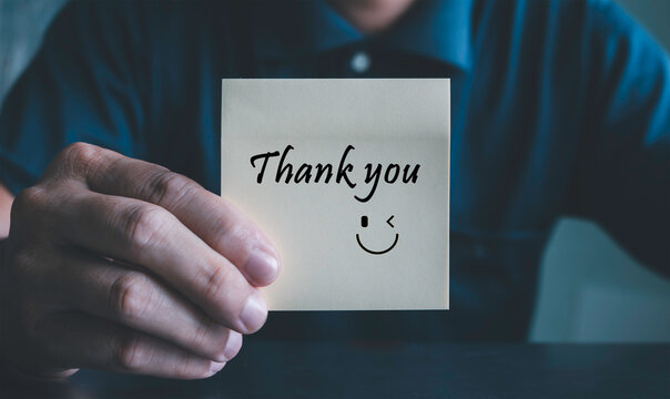 Thank you, message and smiley face, gratitude, customer appreciation, positive feedback, business communication, brand loyalty, and professional relationship building. businessman holding sticky note