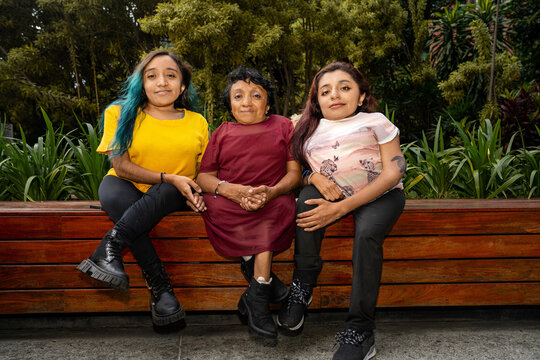 Small group of women with osteogenesis imperfecta and dwarfism in a public park