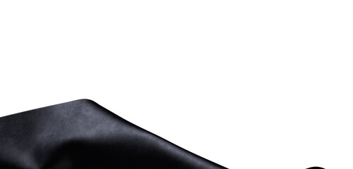 A close-up shot of a black textured surface on a white background, perfect for adding a touch of elegance to any design. © vegefox.com