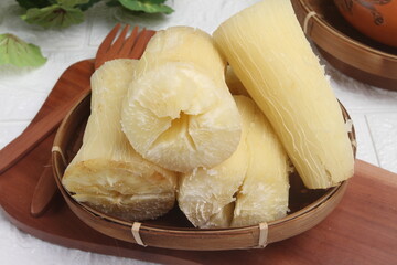 boiled cassava on wooden table