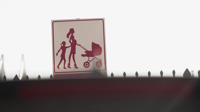 Reserved parking only for women only with the symbol of a pregnant and a mother with a stroller, selective focus cinematic shot