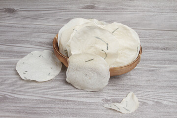 Fototapeta premium cassava crackers on wooden table