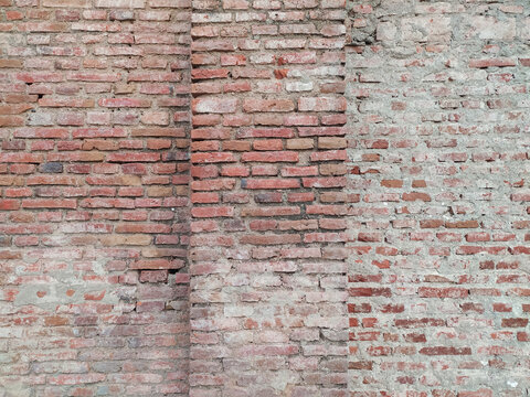 Ancient Red Brick Wall Texture with Grungy and Rustic Appearance.