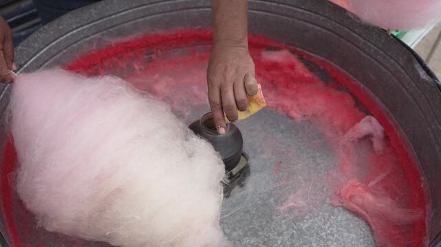 Closeup of of the cotton sugar candy making, slow moiton