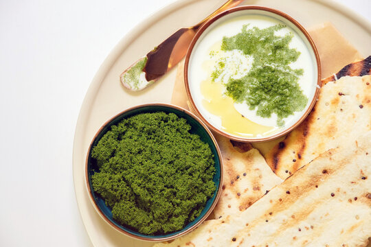 Vegan recipes with tortillas and wolffia spread on wooden plate. Wolffia is the nutrient-rich plant-based source of protein and omega3 and vital minerals.