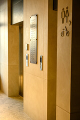 Elevator area with directional signage and floor indicator in modern building © Alexander