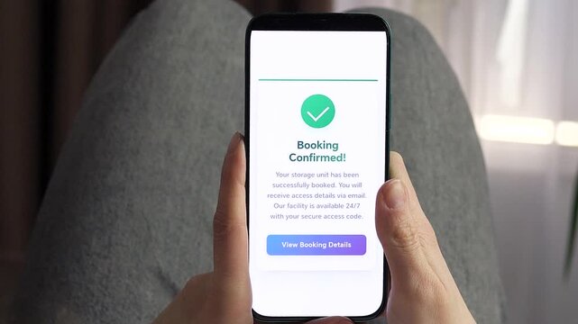 Close-up of hands booking a storage unit via smartphone app. User selects plan, confirms rental, sees processing screen and success message. Modern mobile interface concept for self storage, fintech