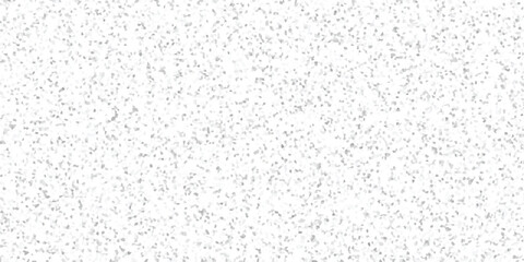 Textured abstract background featuring a dense arrangement of small, irregular grey and white mosaic tiles creating a subtle speckled effect for creative projects