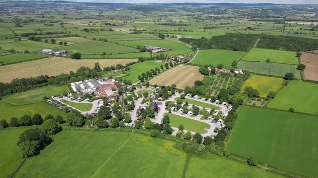 Expansive Aerial View of Green Somerset Levels and Countryside Patchwork Fields Near Glastonbury England