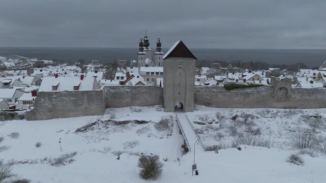 Drone Orbit Around Dalmansporten, Visby City Wall - Winter in &Ouml;stergravar, Gotland Sweden