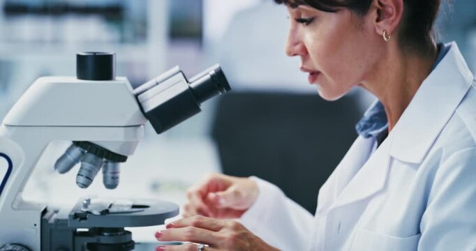 Cell, study and woman with microscope, lab or medical research for mRNA vaccine, serious and biotech. Scientist, writing and innovation for HIV cure development, analysis and mature person with notes