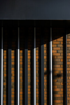 Abstract architectural wall with vertical lines and shadow patterns