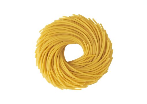 A top down view of uncooked spaghetti pasta arranged in a circular nest shape food