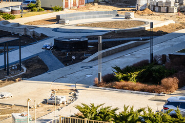 Fototapeta premium Urban park under construction with pathways and greenery