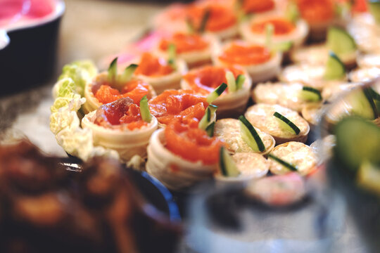 Tartlets with salmon on the festive table. High quality photo