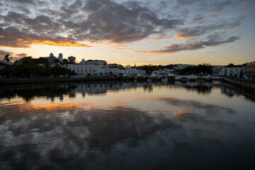 Fototapeta premium Sunset panorama of Tavira Old Bridge and riverside, Algarve, Portugal