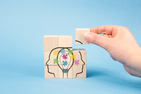 Strategy of team communication, cooperation, networking for implementation of idea, brainstorming, putting puzzle parts together in light bulb mind