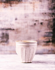 Traditional japanese ceramic on rustic wooden background. Soft focus. Copy space.
