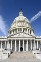 Washington, DC, USA - March 21st 2024 - A closeup of the Capitol building dome in Washington, DC, with the American flag on a nice day.
