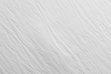 Fototapeta premium White textured surface with subtle lines and patterns created by light and shadow in a minimalist style