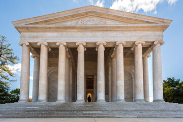 Washington, DC, USA - 13 November 2022 - The Jefferson Memorial on a beautiful sunny day with some clouds and trees.