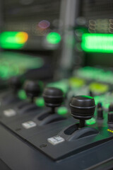 Professional Camera PTZ Controller Joysticks with Green Bokeh and Copy Space © Aliaksei