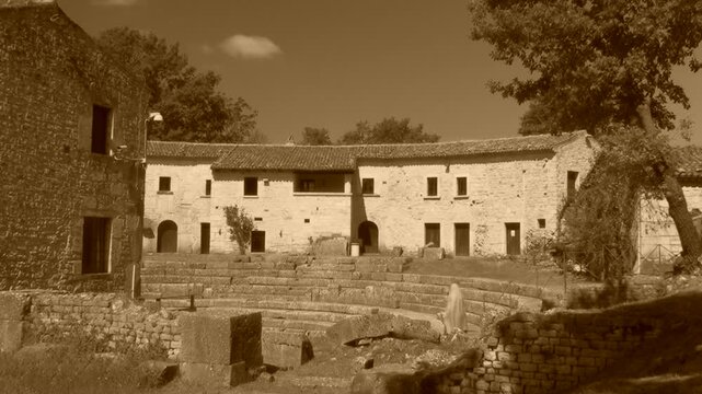 Roman Theatre of Saepinum with rural stone houses, Altilia archaeological site, Molise, Italy