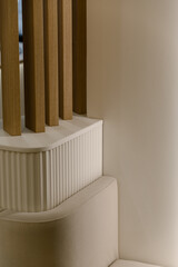 Obraz premium Modern interior design with wooden slats and curved white furniture