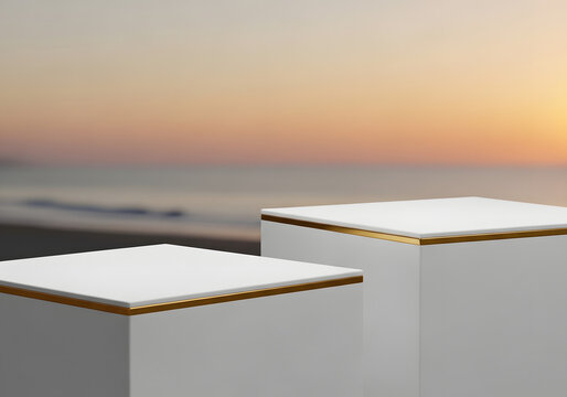 Minimalist white table set with golden trim at sunset beach backdrop