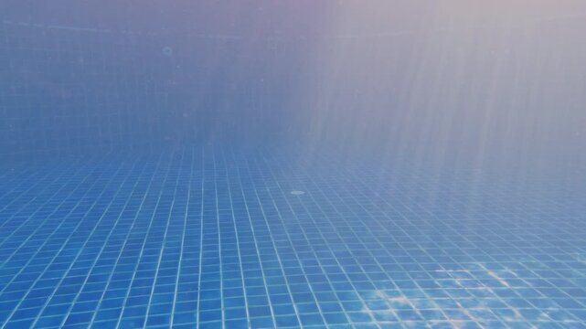 Empty Underwater Pool Space With Blue Tiles And Soft Sun Rays Creating Meditative Mood, Wide Angle Scene Showing Depth And Tranquility