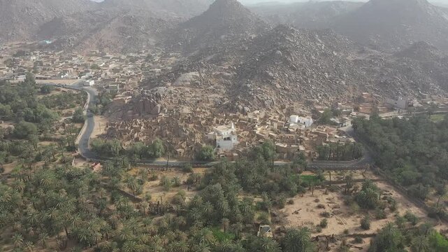 Cinematic aerial view of Djanet oasis town in Sahara desert Algeria