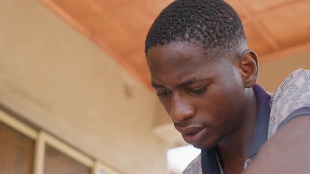 Athlete rests peacefully. Male athlete cools down following intense training session outdoor. Portrait of male sportsman calming down and reflecting after rigorous physical activity outdoors