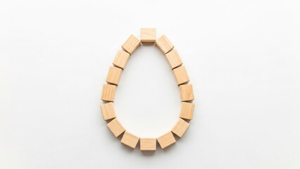 Naklejka premium Wooden Blocks Forming Oval Shape on White Background