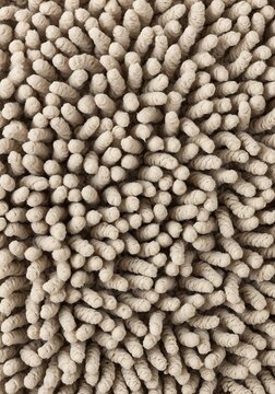 Macro Texture of Soft Cream Colored Chenille Fabric or Rug Material
