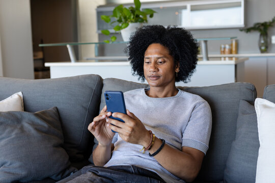 Two people on moving walkway requesting clarification while inspecting diagram at airport platform