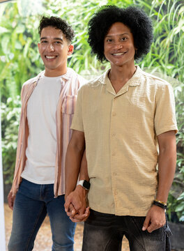 Male teacher pointing, explaining linear algebra on whiteboard with matrices, polynomials in class