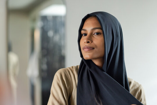 Student mid20s sitting in study explaining Fourier cosine series on whiteboard computing sum 1 or n^